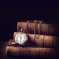 Old vintage books and a watch