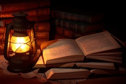 Old oil lamp and old books