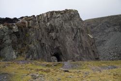 cave in natural cliff face in snowdonia, north wales