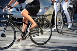 Woman on bicycle in traffic