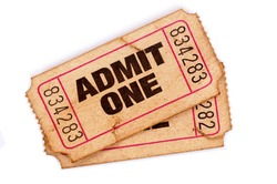 Old ticket : Two vintage torn admit one movie tickets isolated on white.  