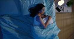 overlooking of asian woman sleep well with smile at night 