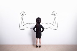Back view of business woman with sketched strong and muscled arms, she look white wall background
