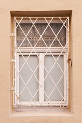   single window with window grille in the old town of Wittenberg in Germany                       
