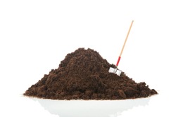 Black heap sand with shovel isolated on white background