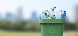 Recycling bin full of plastic waste, separate waste collection concept