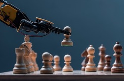 Robot moving chess pieces on chessboard, close up