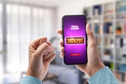 User winning jackpot on online casino app, online games and gambling concept, POV shot