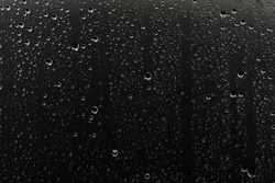 black wet background / raindrops for overlaying on window, concept of autumn weather, background of drops of water rain on glass transparent