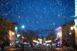 wet window city lights rain drops, abstract background autumn winter glow glass