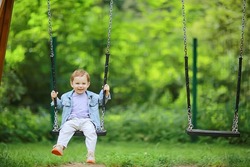 springtime, a boy in the spring swinging on a swing, leisure enjoyment childhood summer happy child