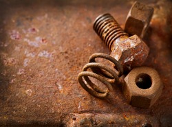Old rusty bolts and steel nuts