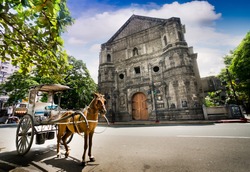 Horse Drawn Carriage parking in front of Malate church , Manila Philippines
