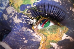 womans face with planet Earth texture and namibian flag inside the eye. Elements of this image furnished by NASA.