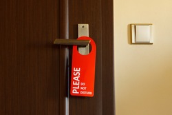 doors with sign for personal -do not disturb