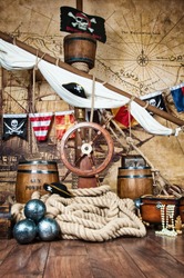 Pirates ship deck with steering wheel and flag
