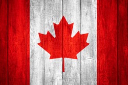 Canada flag or white or red and white Canadian banner on wooden background