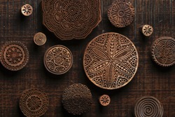Round shape traditional Indian wood block pattern for textile printing on rustic wood background. Block Printing,Rajasthan India Block Printing,Wood block used for handmade textile printing,Hand craft