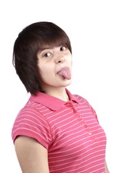 Portrait of young funny woman with her tongue out on white background
