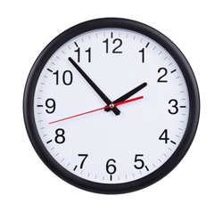 Round office clock shows five minutes to two