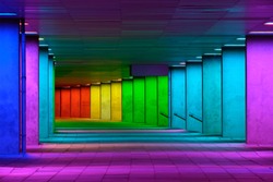 Colorful mulitcolord illuminated gallery tunnel rainbow passage under NAI building, Nederlands Architecture Institute near Museum Park, Rotterdam, The Netherlands