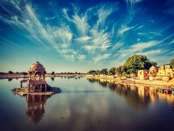 Vintage retro effect filtered hipster style image of Indian landmark Gadi Sagar - artificial lake. Jaisalmer, Rajasthan, India