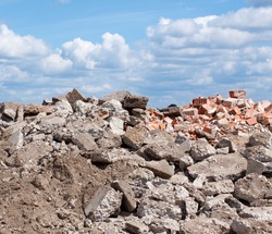 Concrete and brick rubble debris on construction site