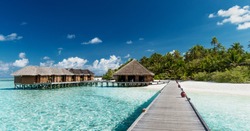 Tropical Beach with Water-Bungalows on the Maldives