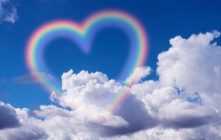 Heart shape rainbow in the sky.