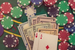 Poker combination with chips playing cards and win dollars in casino table. gambling
