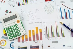 document graph chart annual finance report with pen calculator on desk. Financial accounting. Business office concept. 