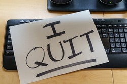Note on a keyboard with the text I QUIT. Great resignation concept