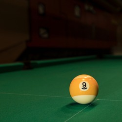 billiard: one ball number nine  on green cloth field, useful  for design-works 