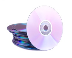 One disc around a stack of compact discs isolated