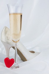 Wedding background, heart, champagne and shoe. Copy space