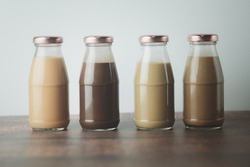 Various of cold coffee, cold Thai milk tea and cold cocoa in retro glass bottles