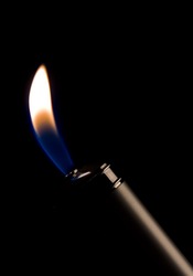 An open butane flame from a gas lighter.
