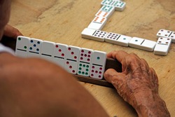 Old man playing domino in Trinidad