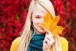 Beautiful young blond woman - colorful autumn portrait