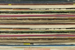Old record carton covers stacked in pile