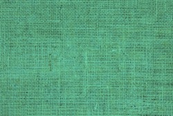 Green burlap with beautiful canvas texture of green fabric in retro style with beautiful green fabric canvas texture as vintage burlap background with burlap texture and beautiful green burlap color