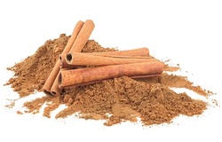 Aromatic cinnamon sticks and cinnamon powder isolated on a white background. Sticks and ground cinnamon.