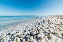 white pebbles and turquoise sea in Le Saline beach, Sardinia