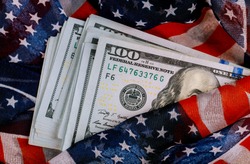 American flag and banknotes USD currency money