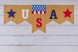 Decorated letter USA sign with patriotism federal holiday of Labor Day Memorial Day of the American flag on wood background