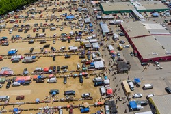 Aerial panorama view on flea market with miscellaneous items and crowds of buyers and sellers in Englishtown NJ US