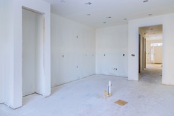 Construction building industry new home construction interior drywall tape and finish details installed door for a new home before installing