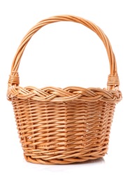 Big wicker basket on a white background. The basket is made of vines. Handmade.