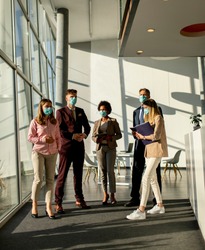 Group of business people meeting and working in the office and wear mask for protect prevent infection by corona virus