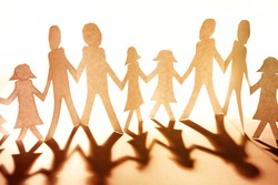 Group of people together holding hands